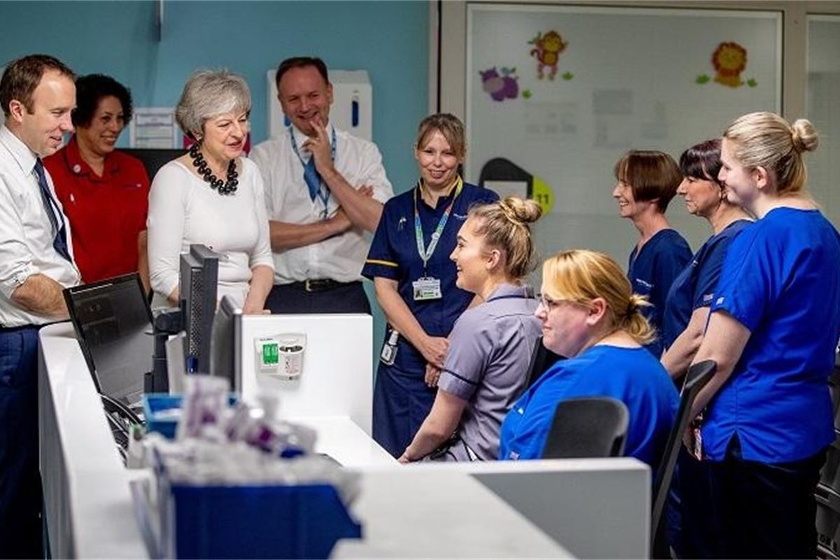 Theresa May unveils 10-year NHS reform plans despite Treasury opposition