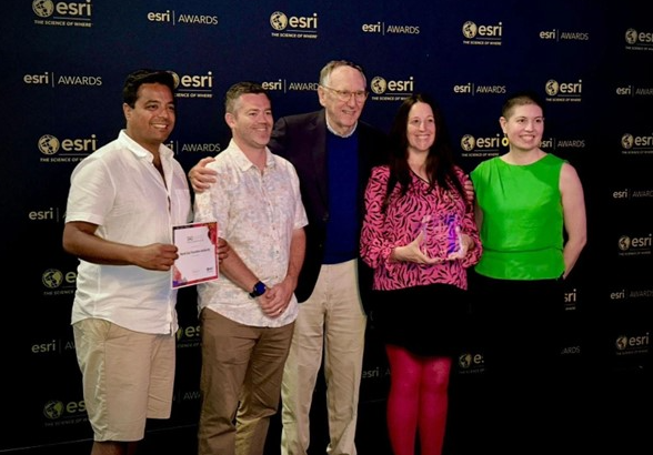 Five people from NTSA pose with their award